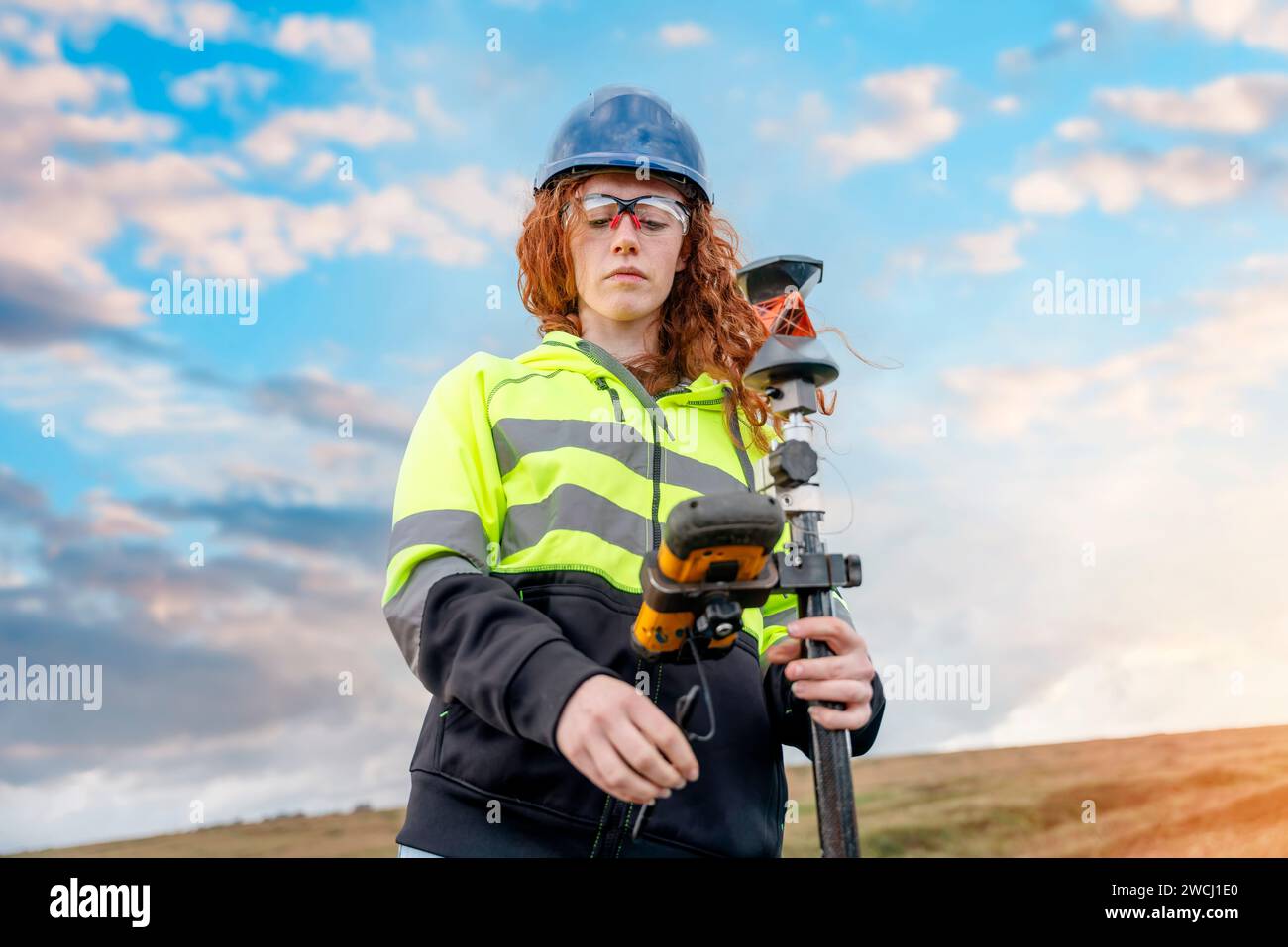 Female Woman land surveyor working with moder surveying geodesic ...