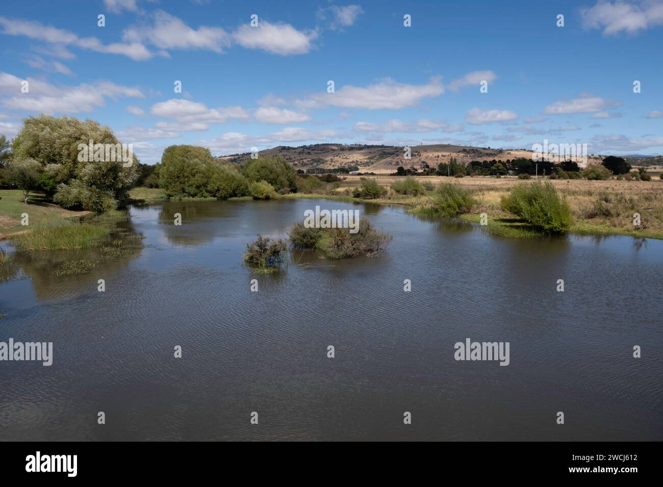 Historic sandstone convict bridge over the Macquarie river in Ross, Tasmania, Australia with beautiful sunny landscape. Widescreen image Stock Photo