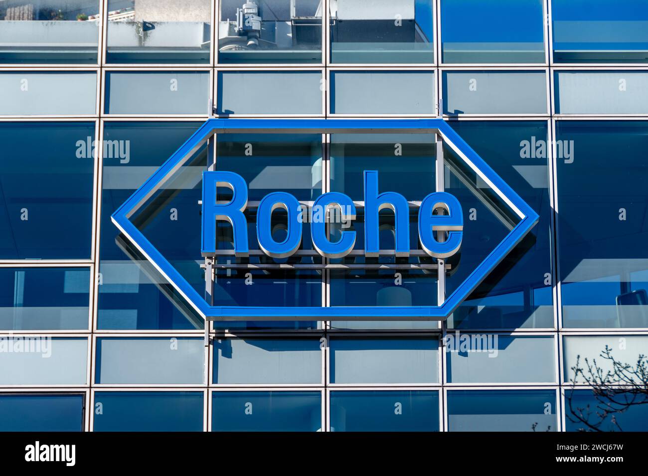 Sign and logo on the building housing the headquarters of Roche France, French subsidiary of the Swiss pharmaceutical group F. Hoffmann-La Roche Stock Photo