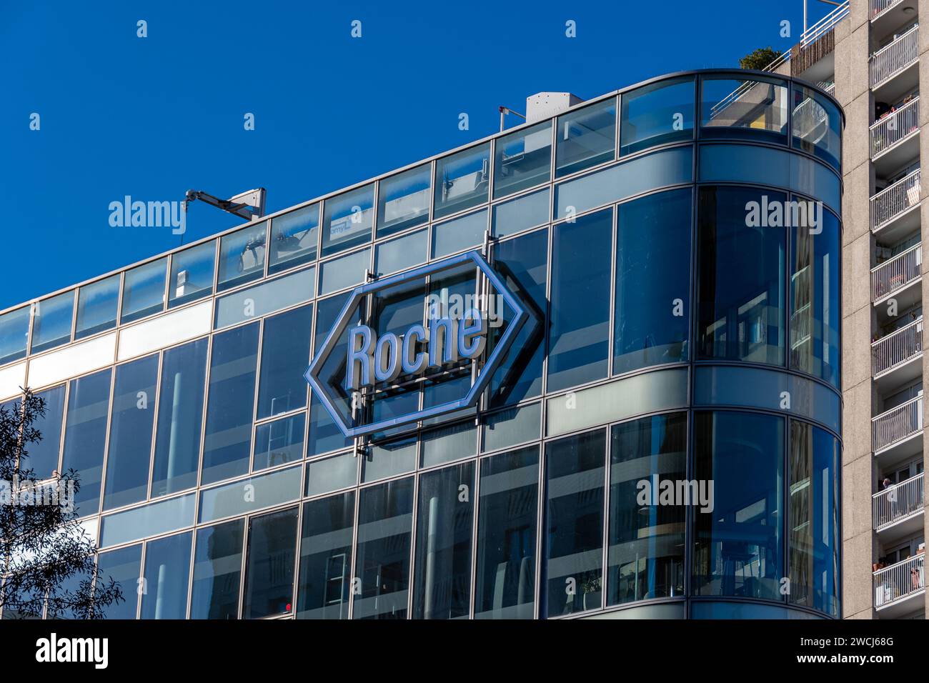 Sign and logo on the building housing the headquarters of Roche France, French subsidiary of the Swiss pharmaceutical group F. Hoffmann-La Roche Stock Photo