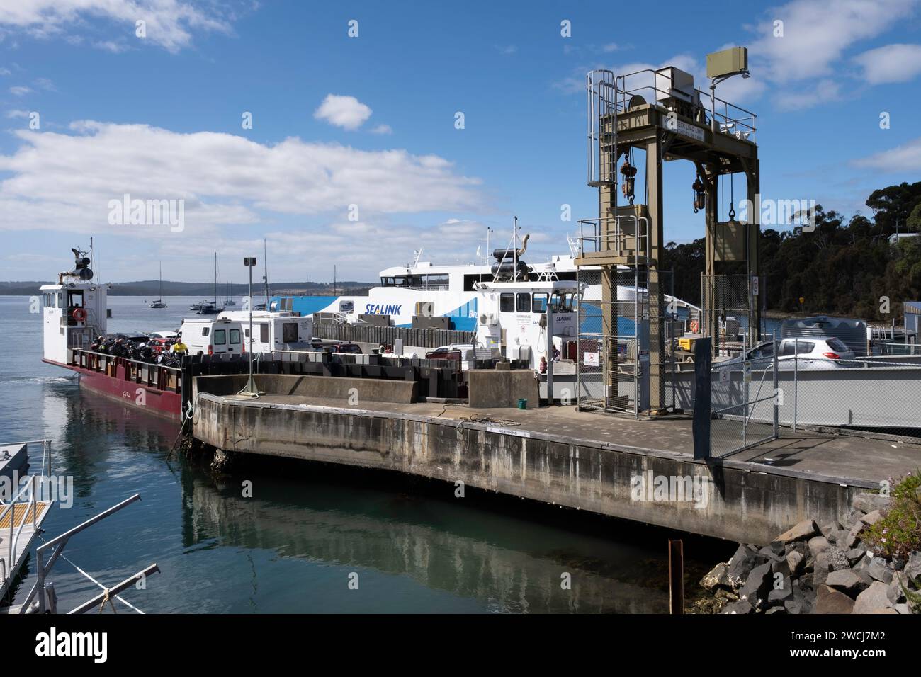 Cars and passengers board the Bruny Island Car Ferry from Kettering to Bruny Island in Southern