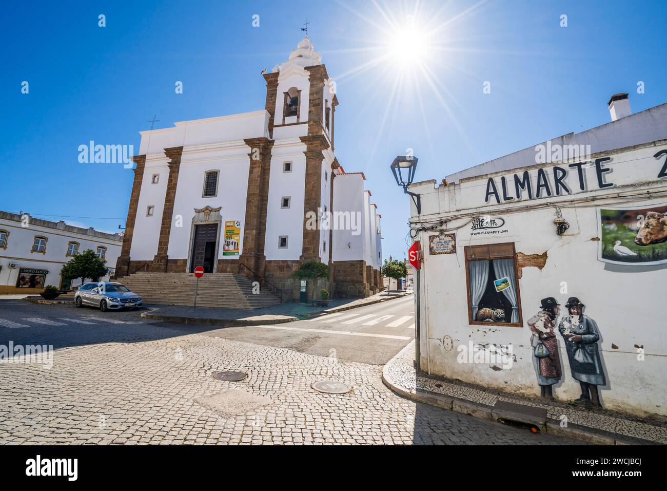 Almodovar , Portugal - March 21, 2023: Saint Ildefonso church and traditional mural in the downtown of Almodovar, Alentejo, Portugal Stock Photo