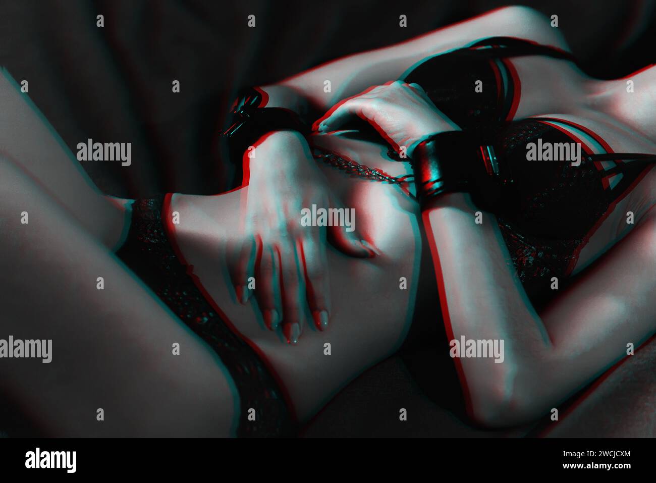 submissive handcuffed slender body of a young submissive girl with handcuffed hands for BDSM sex  with submission and domination. Black and white photo with glitch effect an  Stock Photo - Alamy