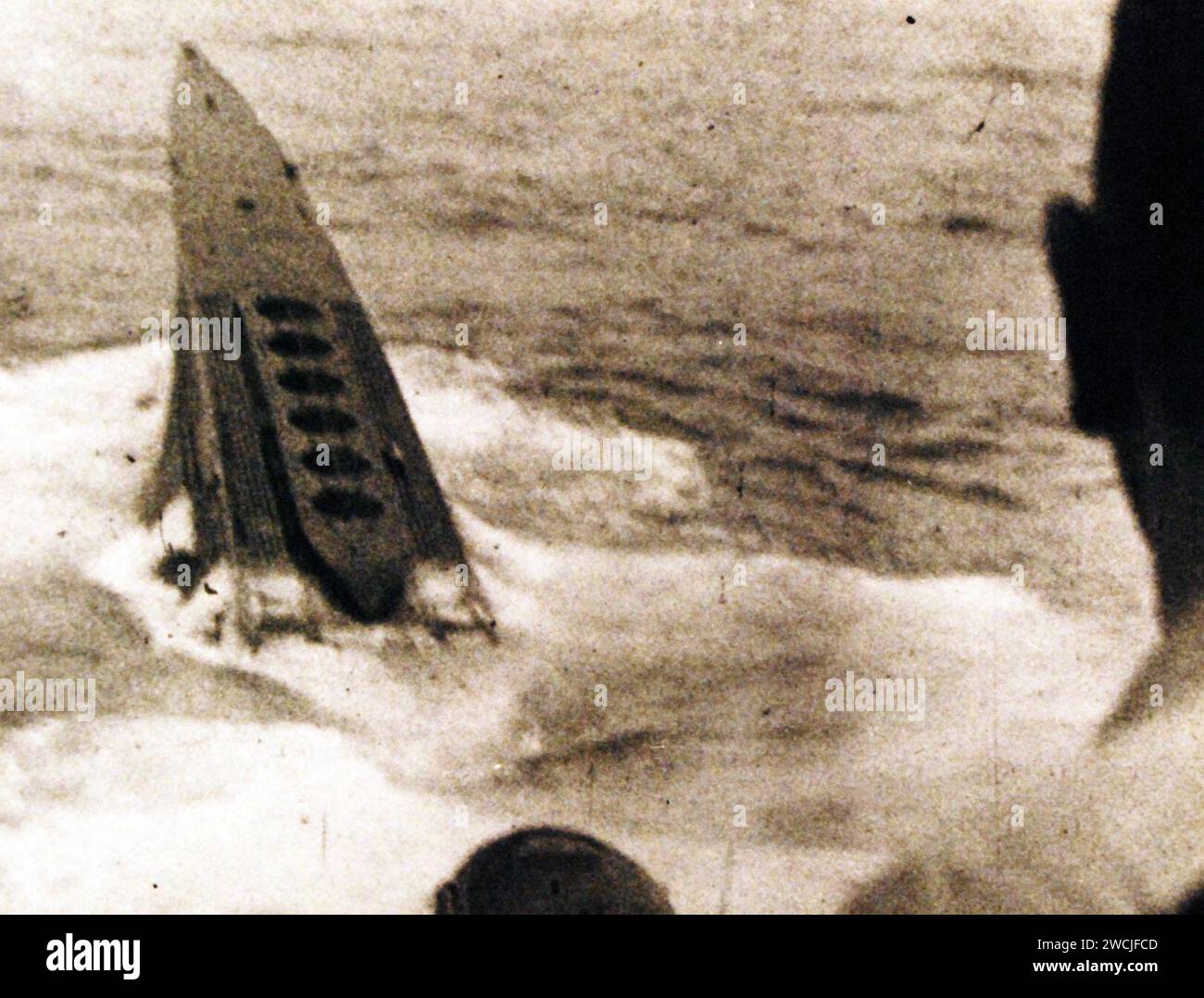 700007 Battle of the Atlantic. German Submarine U-233 sinking after being rammed by USS Thomas (DE 102). Stock Photo