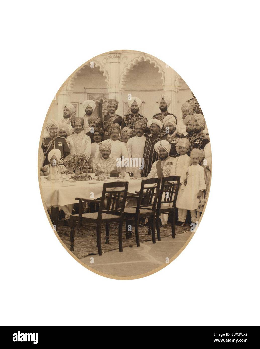 A group photograph of Bhupinder Singh, the Maharaja of Patiala (reg. 1900-1938) with the cricketer Sir Ranjitsinhji Vibhaji Jadeja, known as Ranji, and other guests and servants. Patiala, circa 1910. Stock Photo