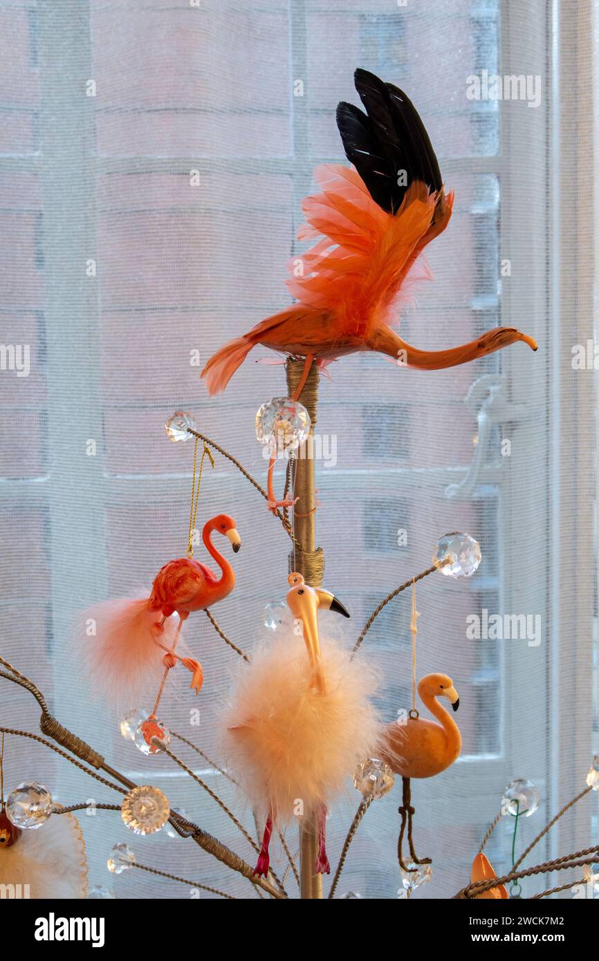 Whimsical flamingo Christmas ornaments on a stylized metal and glass Christmas tree, 2024, New York City, USA Stock Photo