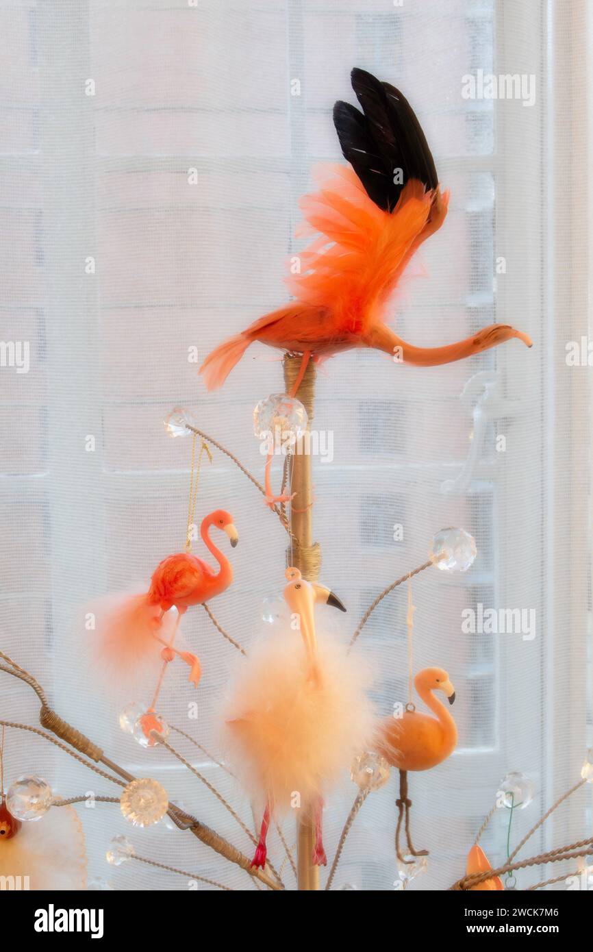 Whimsical flamingo Christmas ornaments on a stylized metal and glass Christmas tree, 2024, New York City, USA Stock Photo