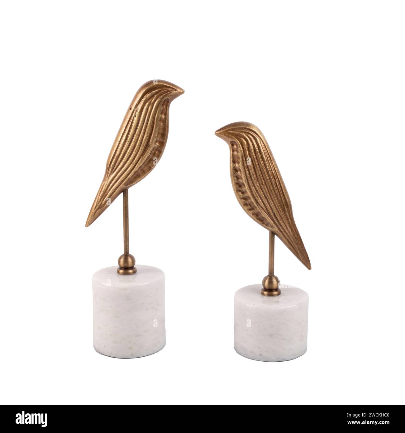 luxury decorative metal bird figures on marble isolated on white background Stock Photo