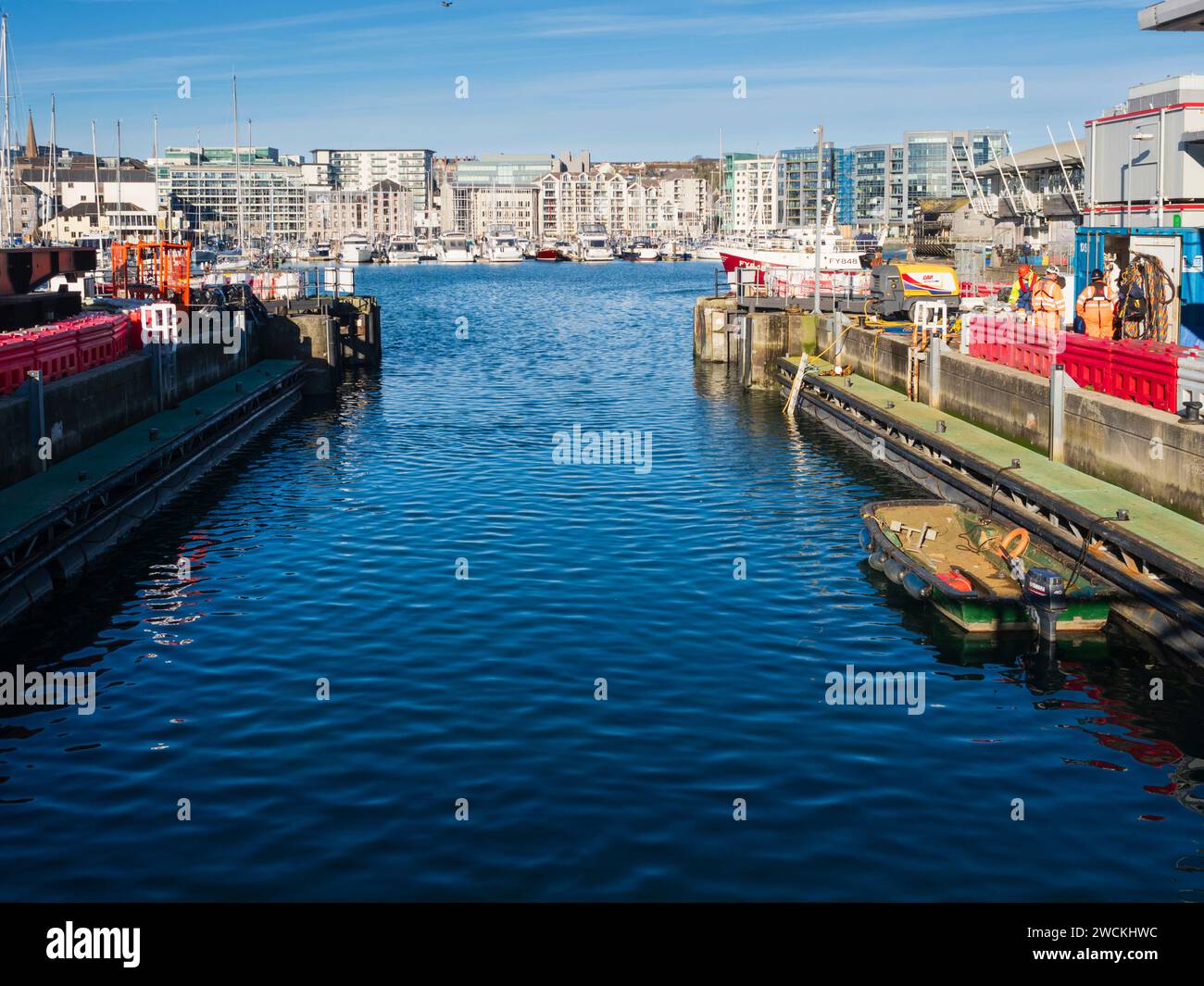 Entrance to Sutton Harbour and commercial and pleasure marina through the tidal lock Stock Photo
