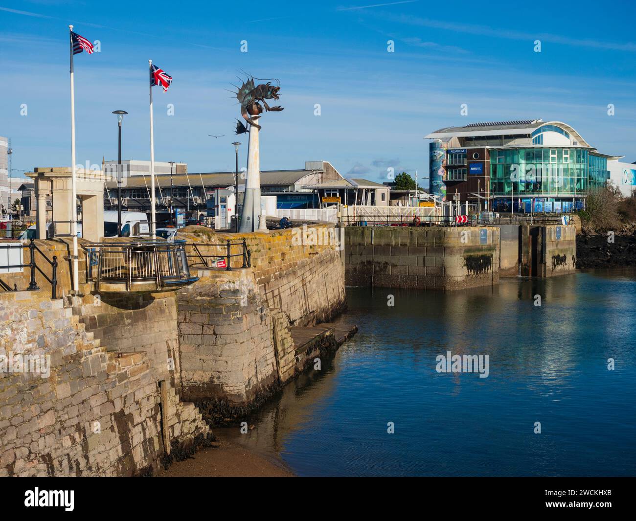 Mayflower steps balcony, Barbican Prawn sculpture and National Marine Aquarium on the front of Sutton Harbour, Plymouth Stock Photo