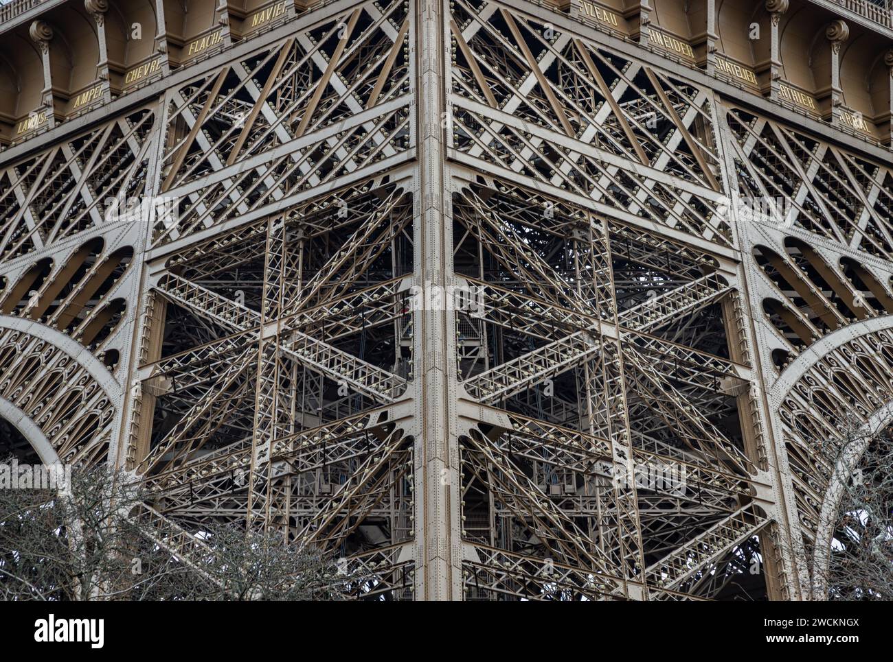 France, Paris - Jan 4, 2024 - Architectural detail design of the famous Eiffel Tower iron structure. Close-up of the framework of the Eiffel Tower in Stock Photo