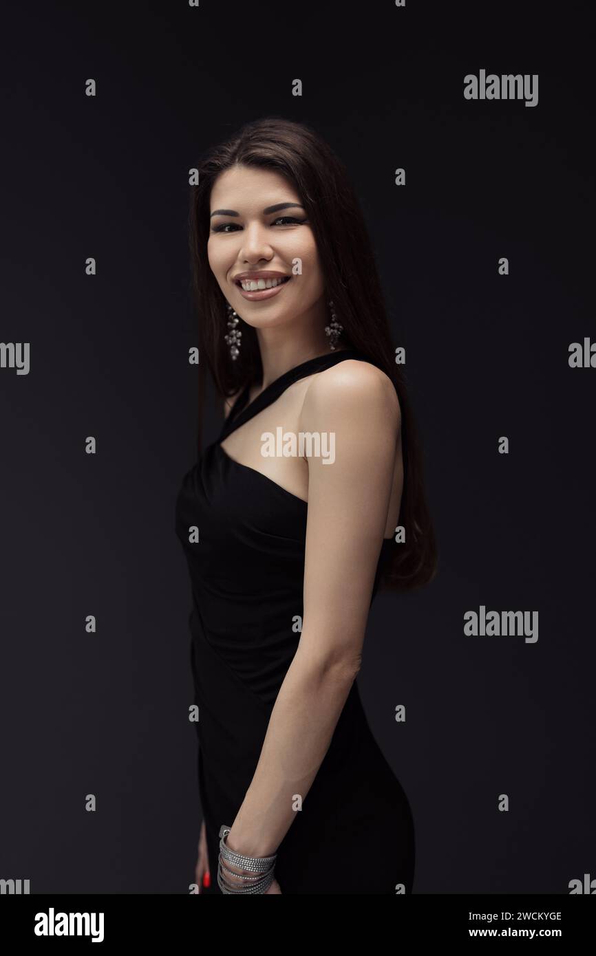 Woman in Black Dress Posing for Picture Stock Photo - Alamy