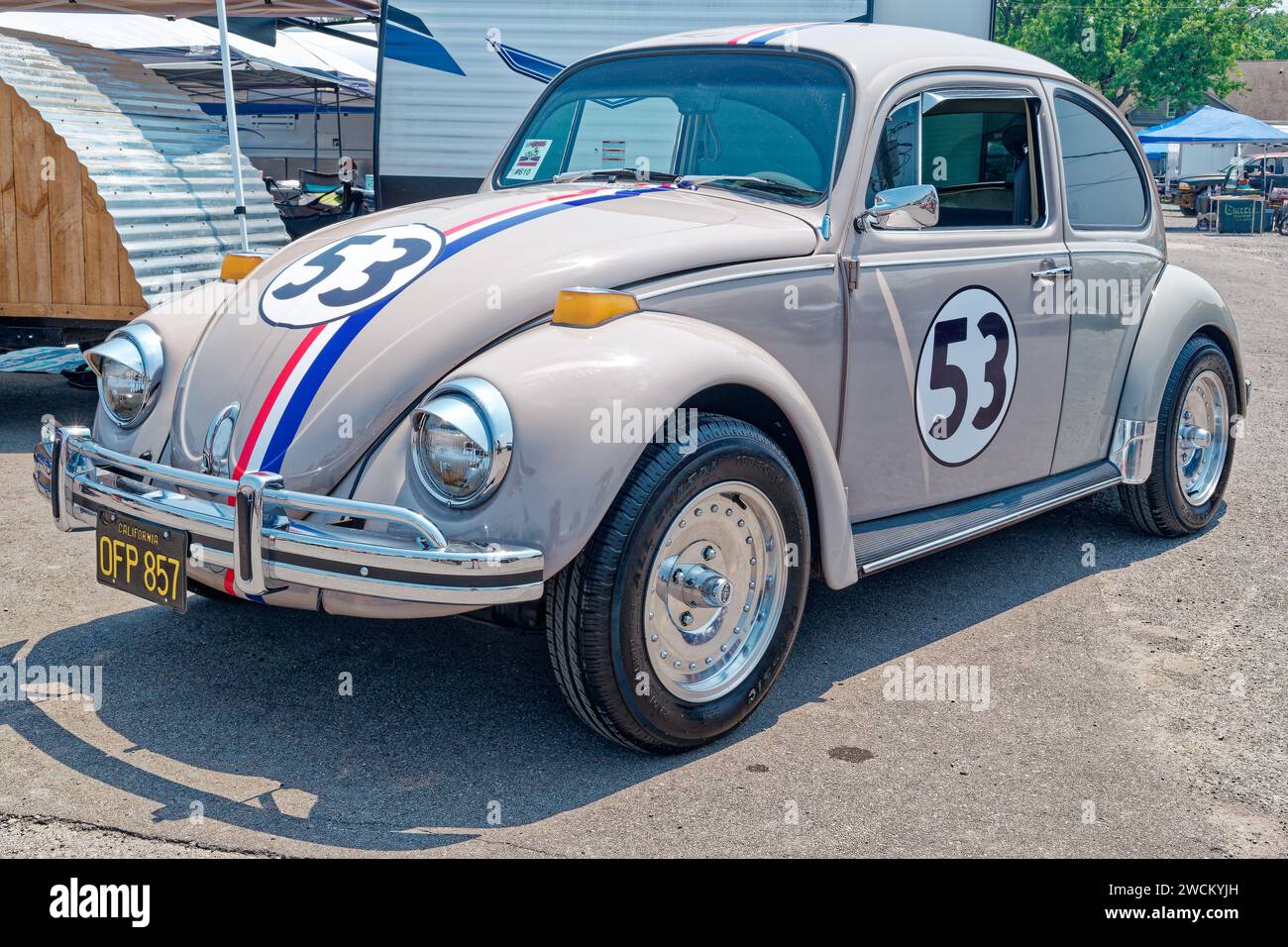Iconic movie star form the late 1960's Herbie the love bug this one is a restored Volkswagen beetle look a like at a car show closeup front to side vi Stock Photo
