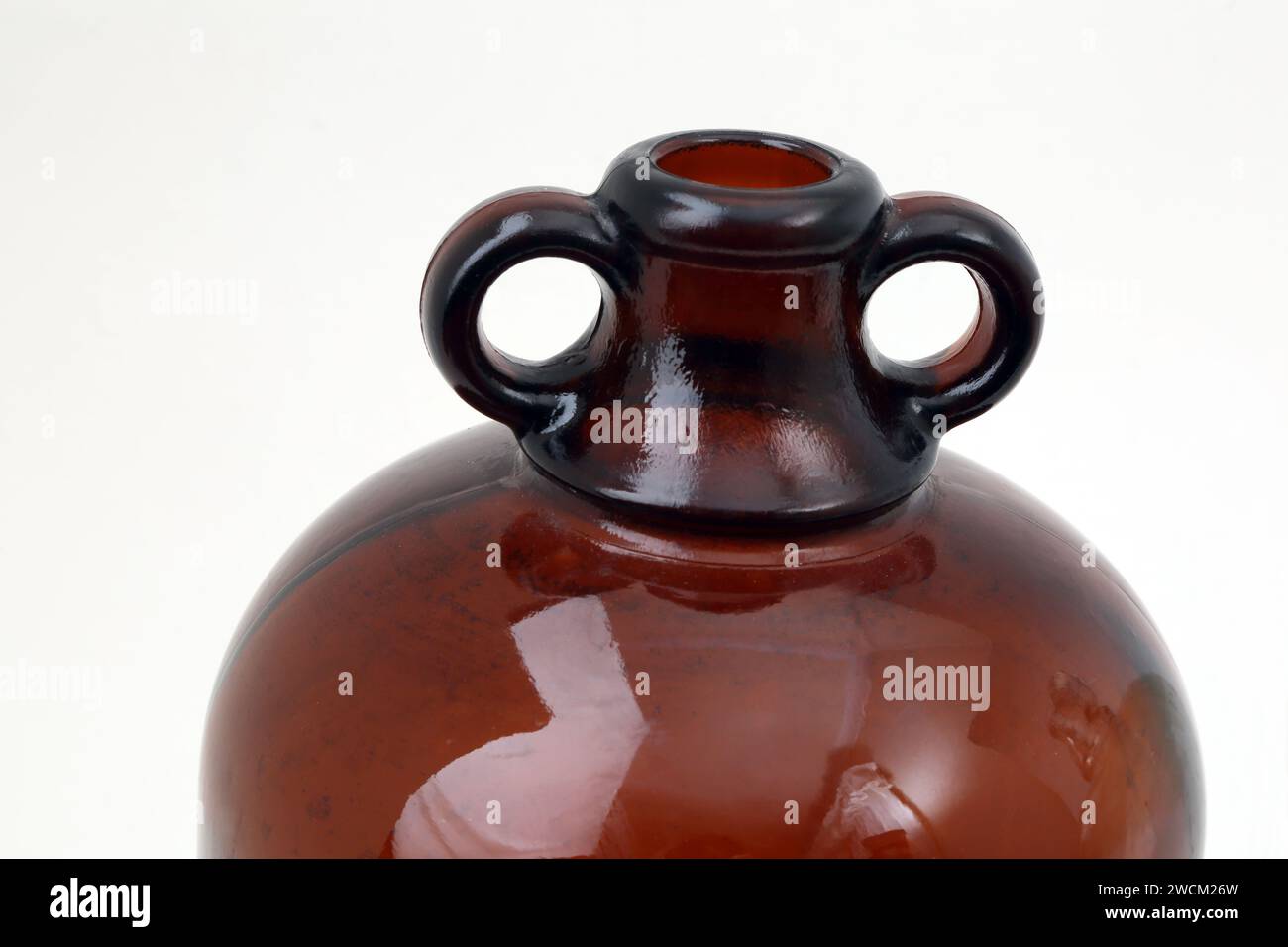 Top of A Large Brown Glass Demijohn used for Fermentation of Beverages Stock Photo