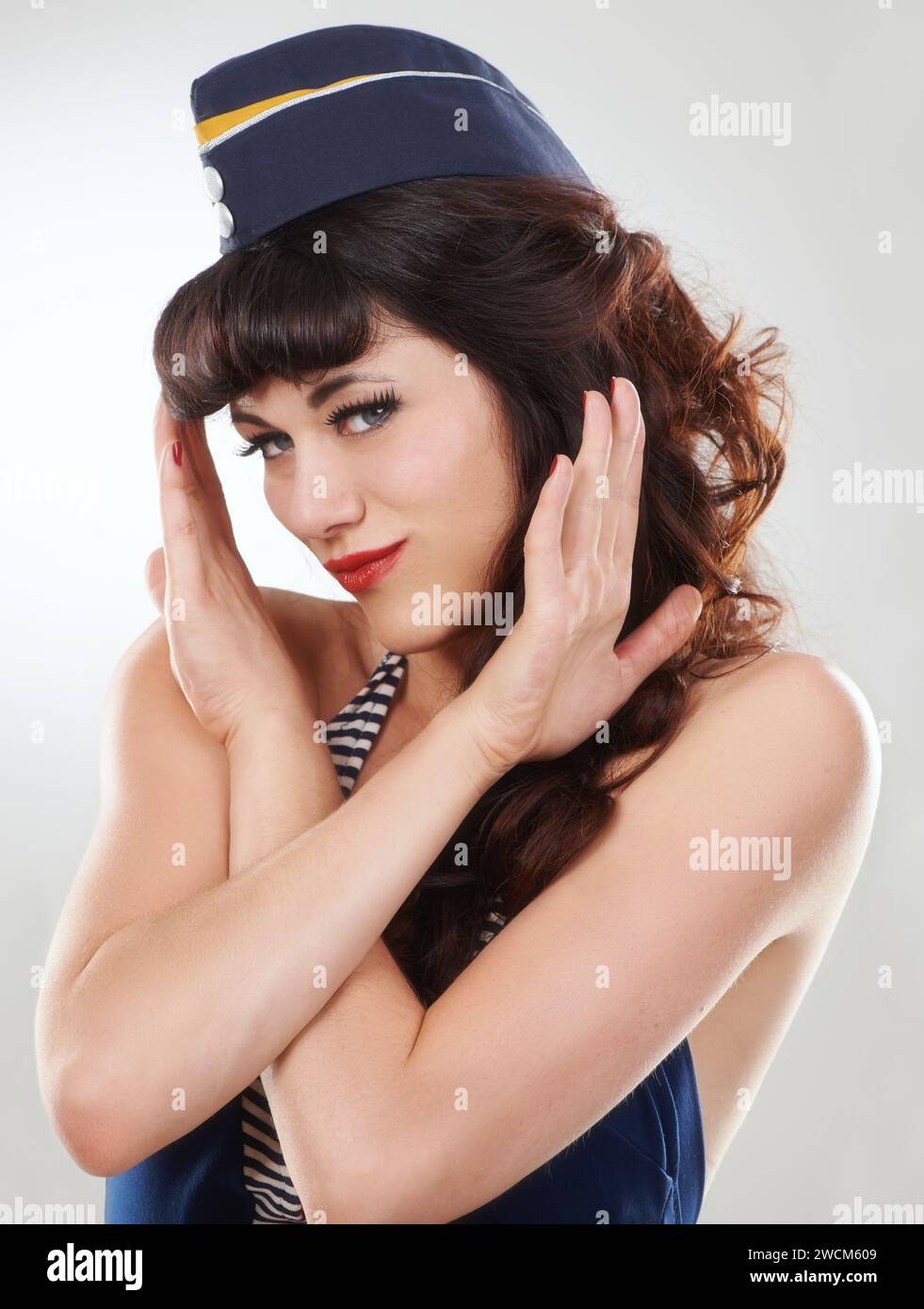 Portrait, sailor woman and stop hands of model in studio isolated on white background. Face, no or rejection of vintage pin up girl in hat with Stock Photo