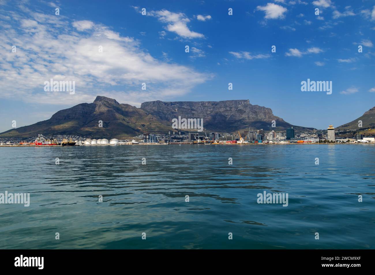 A breathtaking landscape featuring a majestic mountain surrounded by a ...