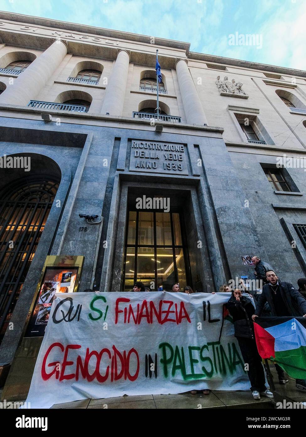 Pro-Palestinian blitz at the Intesa Sanpaolo bank Pro-Palestinian blitz at the Intesa Sanpaolo headquarters in via Toledo. This afternoon, a few dozen activists burst into the intesa san paolo bank building, chanting chants and slogans for the people of Gaza. Here the genocide in Palestine is being financed reads a large banner unfurled in front of the bank, papered by the protesters with leaflets depicting the macabre images of children who died under bombing in the Middle East. DJI 0719 Copyright: xAntonioxBalascox Stock Photo