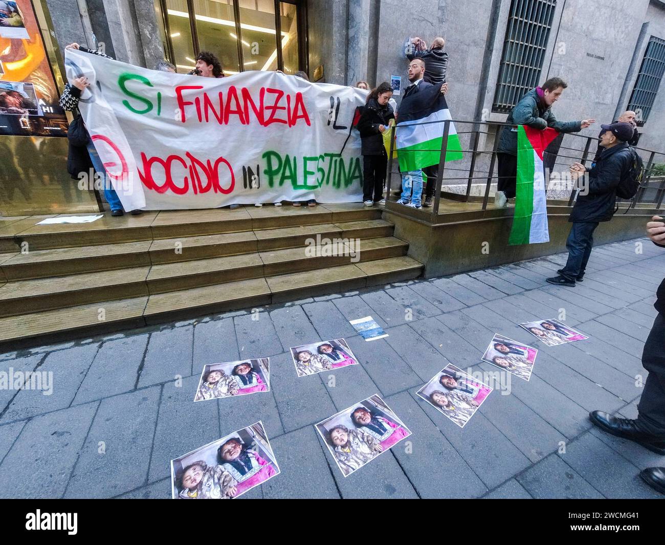 Pro-Palestinian blitz at the Intesa Sanpaolo bank Pro-Palestinian blitz at the Intesa Sanpaolo headquarters in via Toledo. This afternoon, a few dozen activists burst into the intesa san paolo bank building, chanting chants and slogans for the people of Gaza. Here the genocide in Palestine is being financed reads a large banner unfurled in front of the bank, papered by the protesters with leaflets depicting the macabre images of children who died under bombing in the Middle East. DJI 0717 Copyright: xAntonioxBalascox Stock Photo