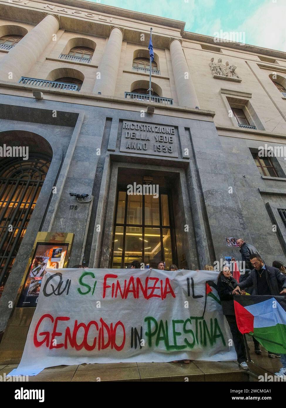 Pro-Palestinian blitz at the Intesa Sanpaolo bank Pro-Palestinian blitz at the Intesa Sanpaolo headquarters in via Toledo. This afternoon, a few dozen activists burst into the intesa san paolo bank building, chanting chants and slogans for the people of Gaza. Here the genocide in Palestine is being financed reads a large banner unfurled in front of the bank, papered by the protesters with leaflets depicting the macabre images of children who died under bombing in the Middle East. DJI 0720 Copyright: xAntonioxBalascox Stock Photo