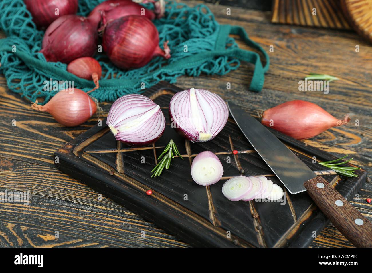 Boards with different kinds of onion on brown wooden background Stock ...