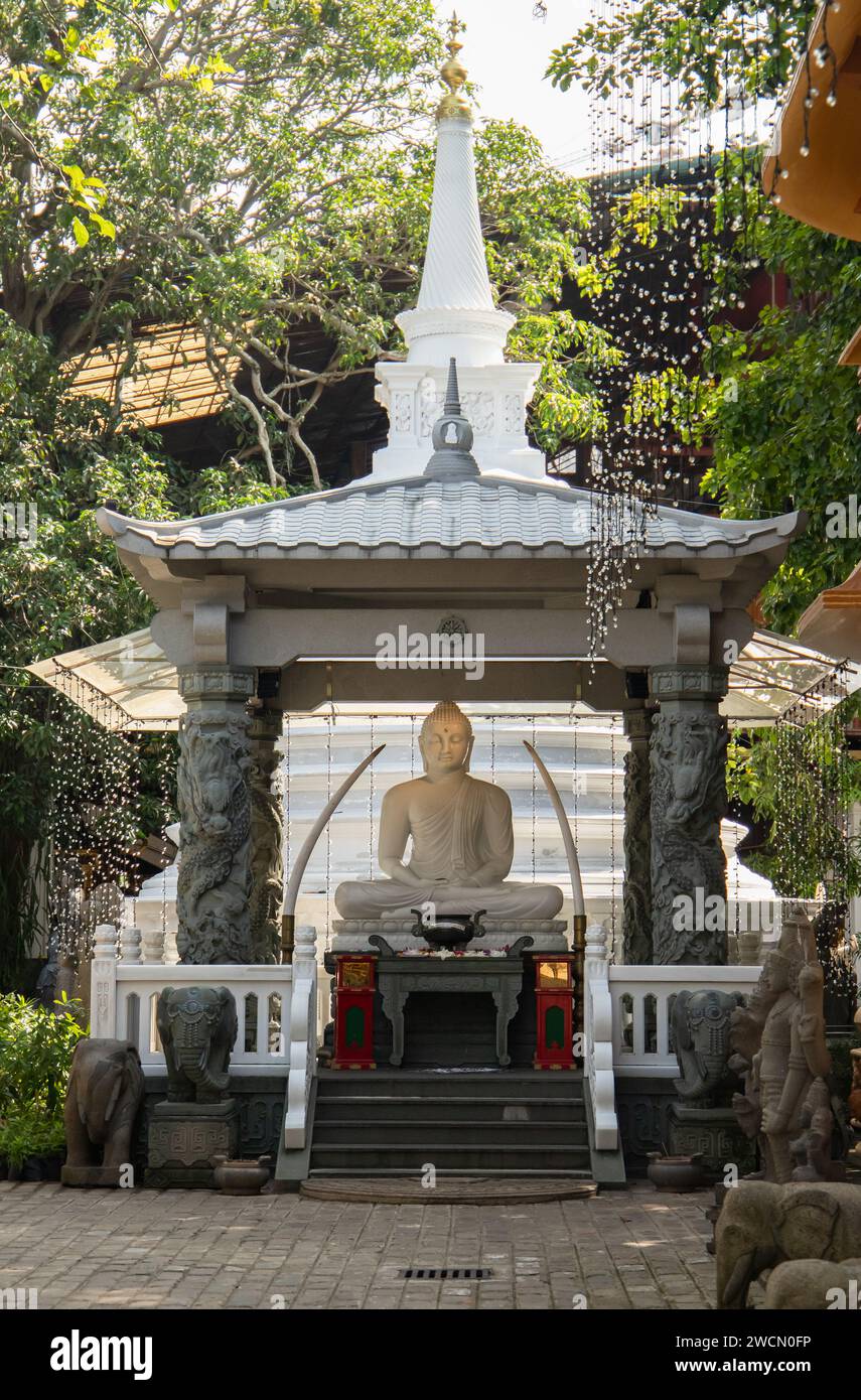 Sitting Buddha. Gangaramaya Temple, Colombo, Sri Lanka Stock Photo