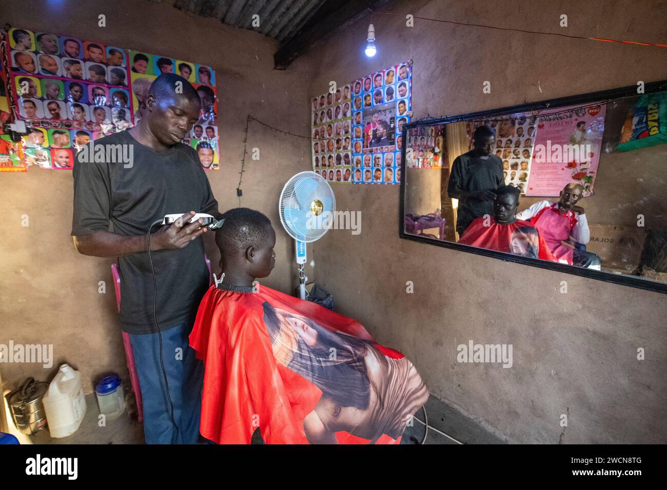 Uganda, Adjumani. A barber shop in a refugee camp. Editorial use only ...