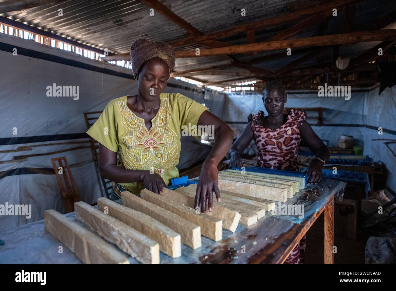 Uganda, Adjumani. Women that received microfinance loans make soap as a new income to generate business. Editorial use only. Stock Photo