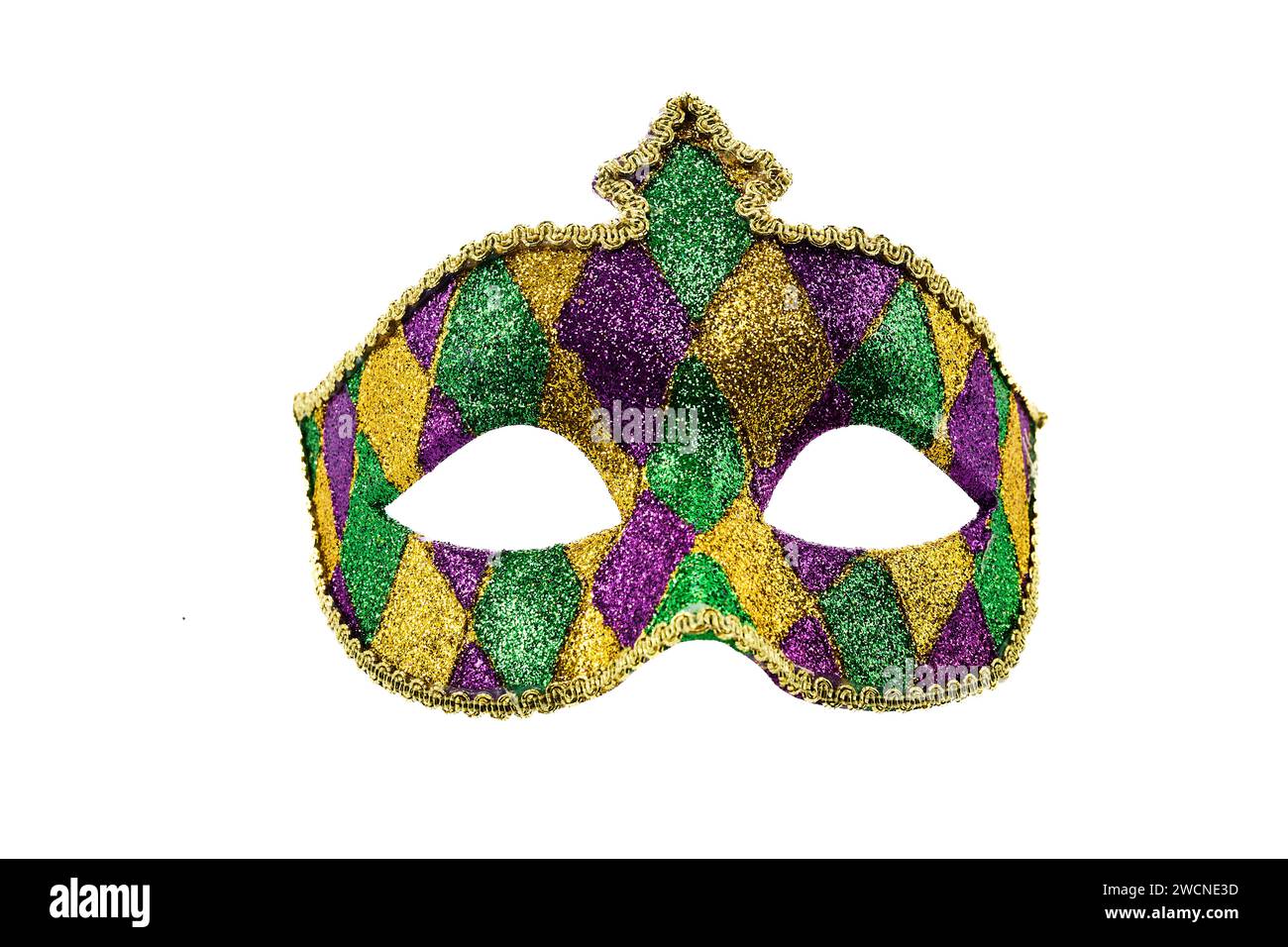 Gold, purple and green glittery Mardi gras mask isolated on white background Stock Photo