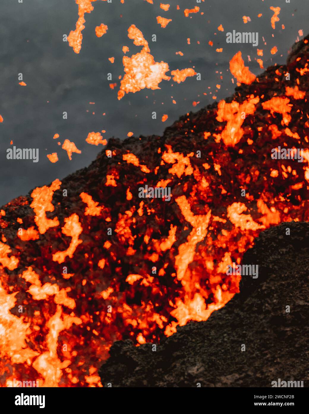 Lava spewing from crater in Geldingadalur Eruption site in Iceland Stock Photo