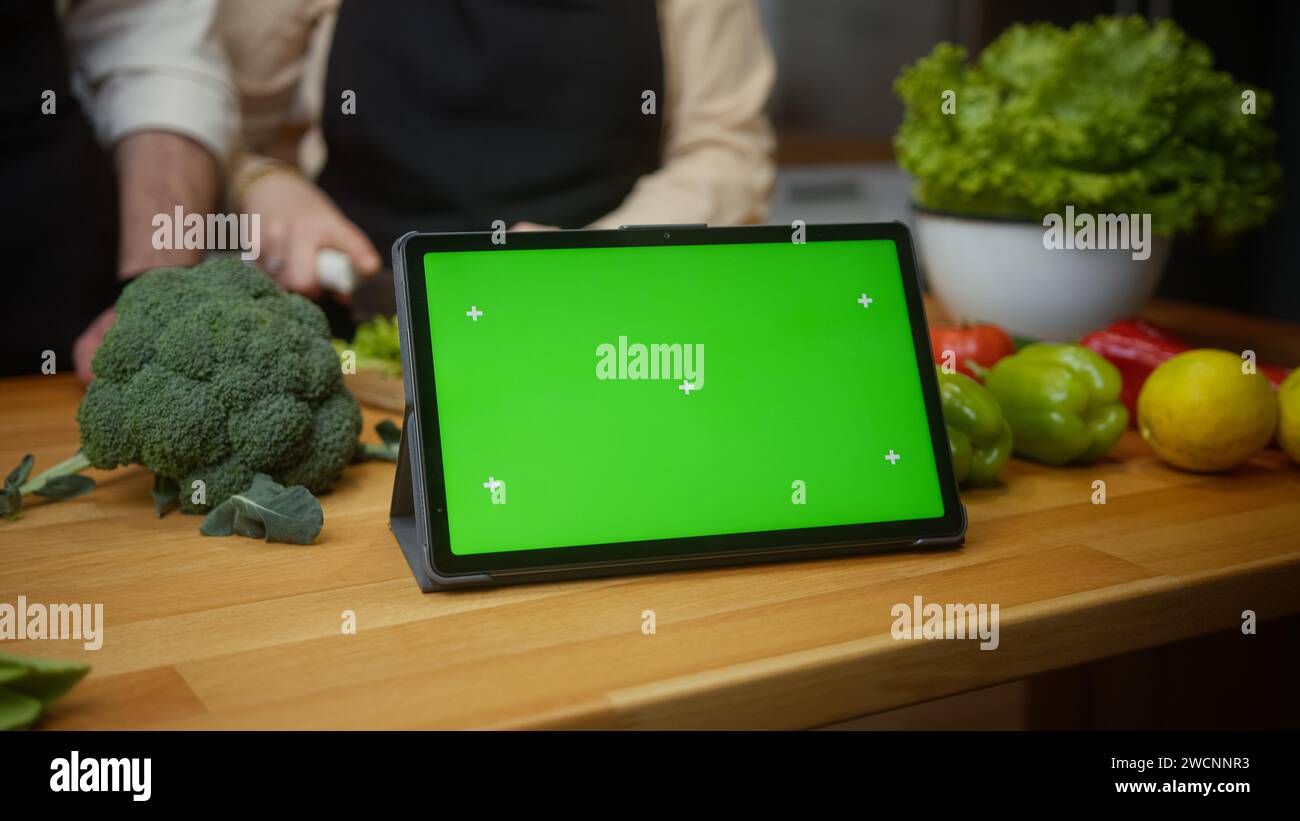 Tablet computer device with mock up green screen chroma key display on
