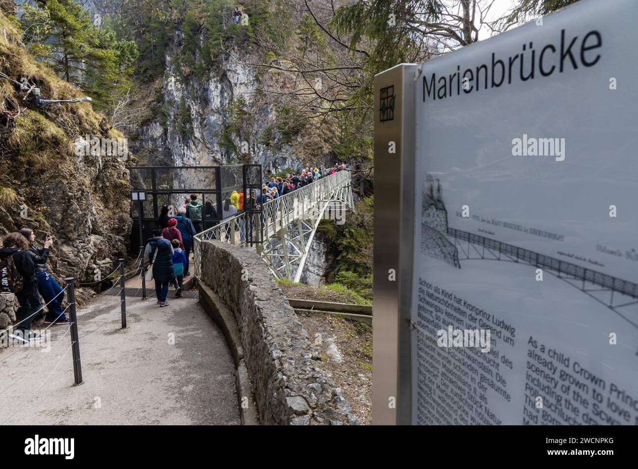 Tourists enjoying the view on the Neuschwanstein castle from the Marienbruecke in Schwangau, a Bavarian village in Germany Stock Photo