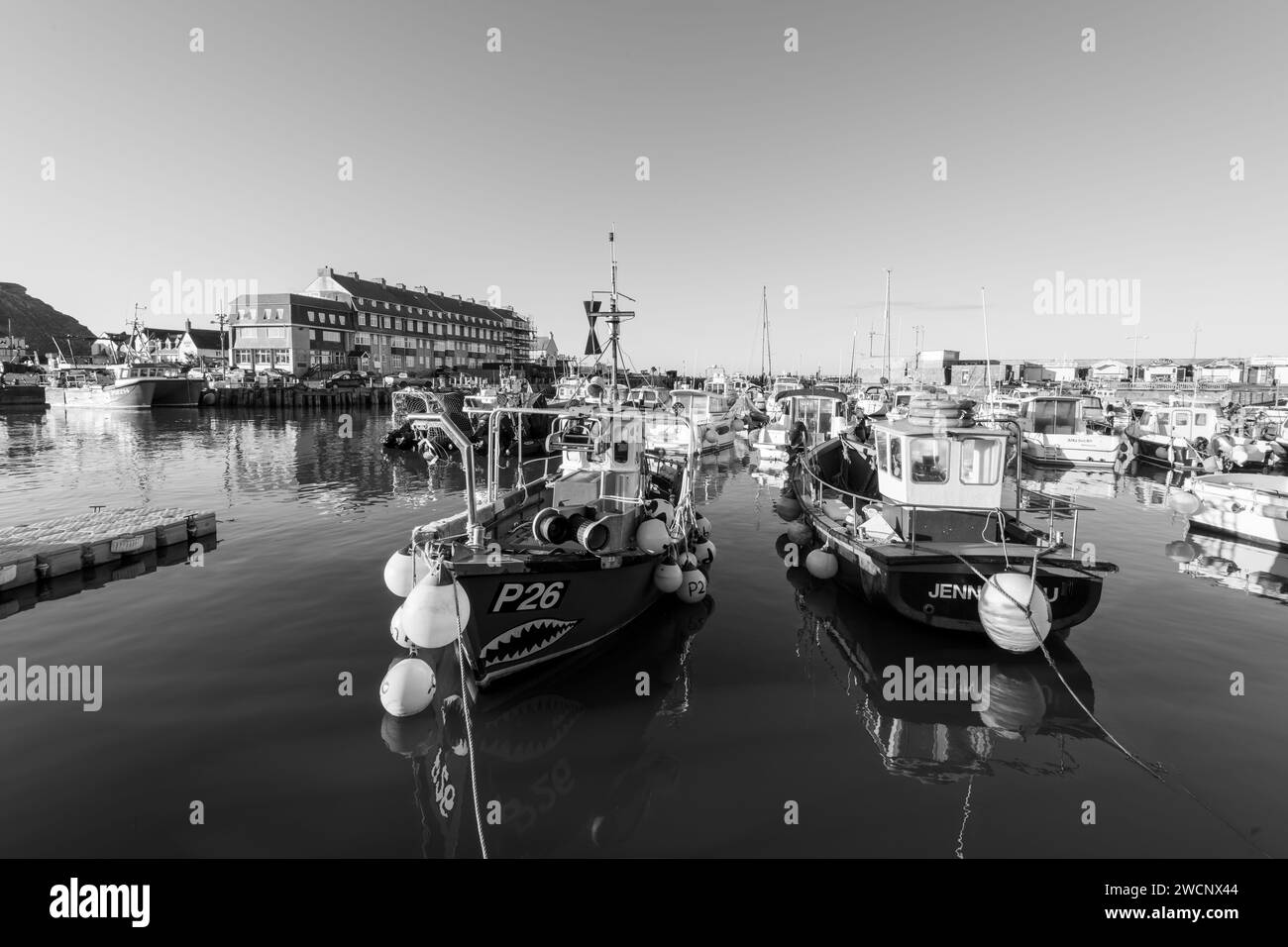 Fishing boats moored in West Bay harbour in Dorset Stock Photo - Alamy