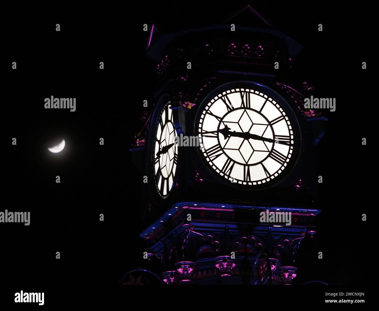 Sheerness Kent UK 16th Jan 2024 UK Weather The Crescent Moon Seen   Sheerness Kent Uk 16th Jan 2024 Uk Weather The Crescent Moon Seen With Sheerness Clock Tower On A Cold Evening In Kent Credit James Bellalamy Live News 2WCNXJN 