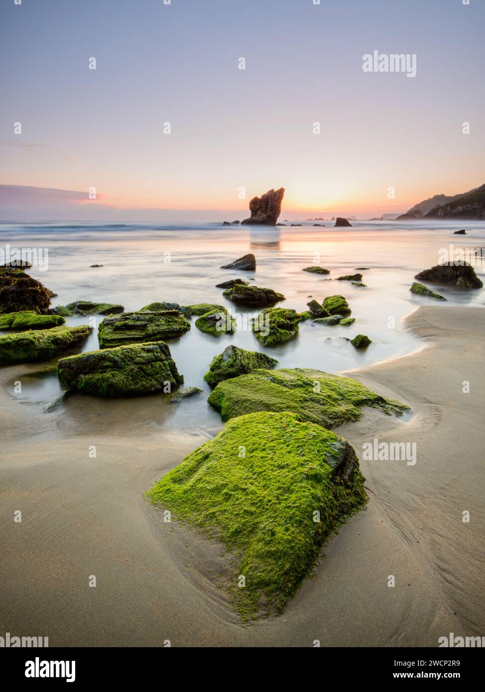 Landscape at Aguilar beach at sunrise with the mythical rocks and cliffs, Asturias, Spain Stock Photo