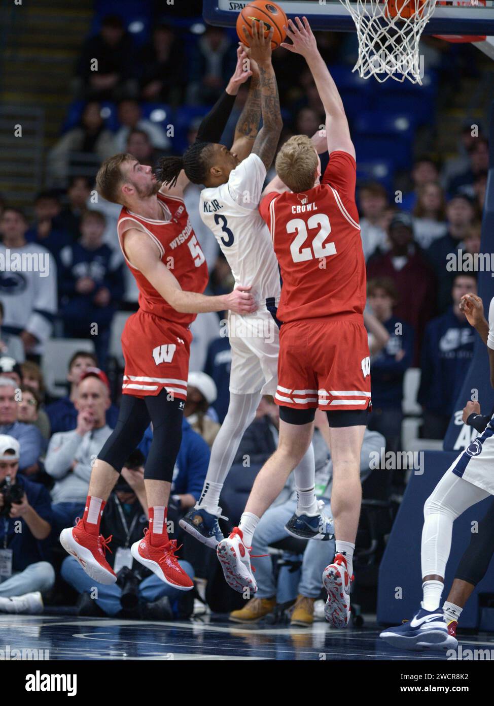 Penn State's Nick Kern Jr. (3) shoots between Wisconsin defenders Tyler