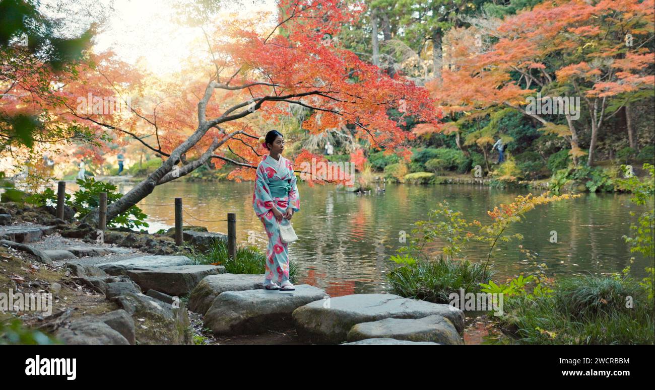 Asian calm woman alone walking hi-res stock photography and images - Alamy