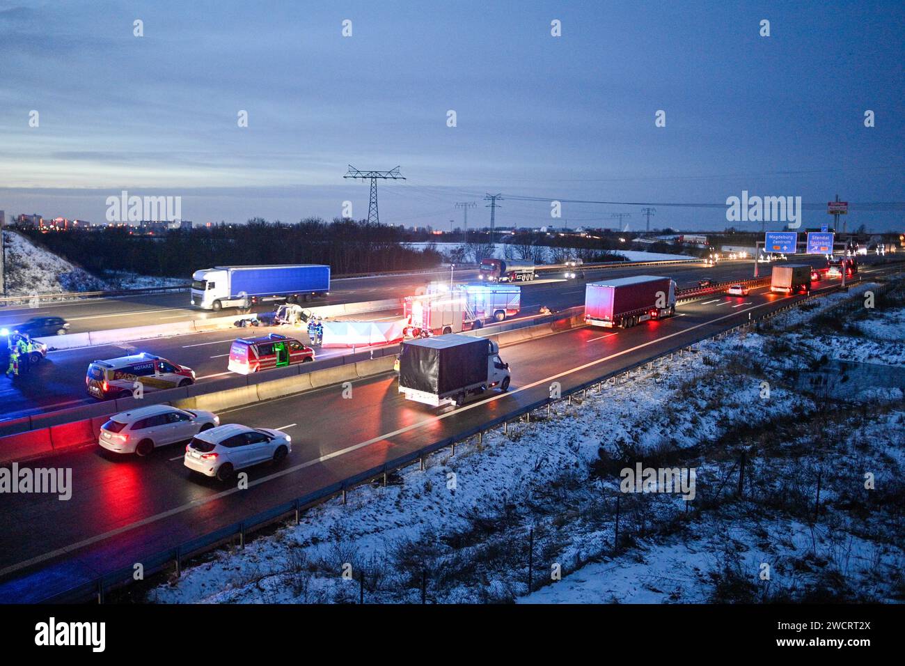 17 January 2024, Saxony-Anhalt, Magdeburg: Emergency vehicles from the fire department and police stand at the scene of an accident on the A2 at the Magdeburg Zentrum exit. A 78-year-old wrong-way driver was killed in an accident there on Wednesday morning. Another person was seriously injured, according to the police. The man had driven onto the highway in the wrong direction. On the carriageway towards Hanover, his car then collided head-on with a van and hit another vehicle. The wrong-way driver died at the scene of the accident. One person in the van suffered serious injuries. Photo: Klaus Stock Photo