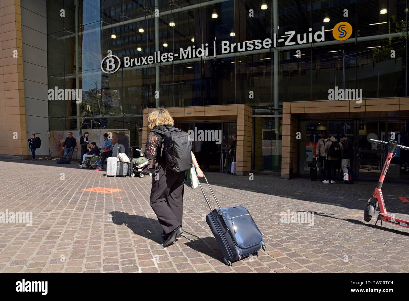 Train passengers at the entrance to Brussels Midi / Zuid international railway station, Belgium