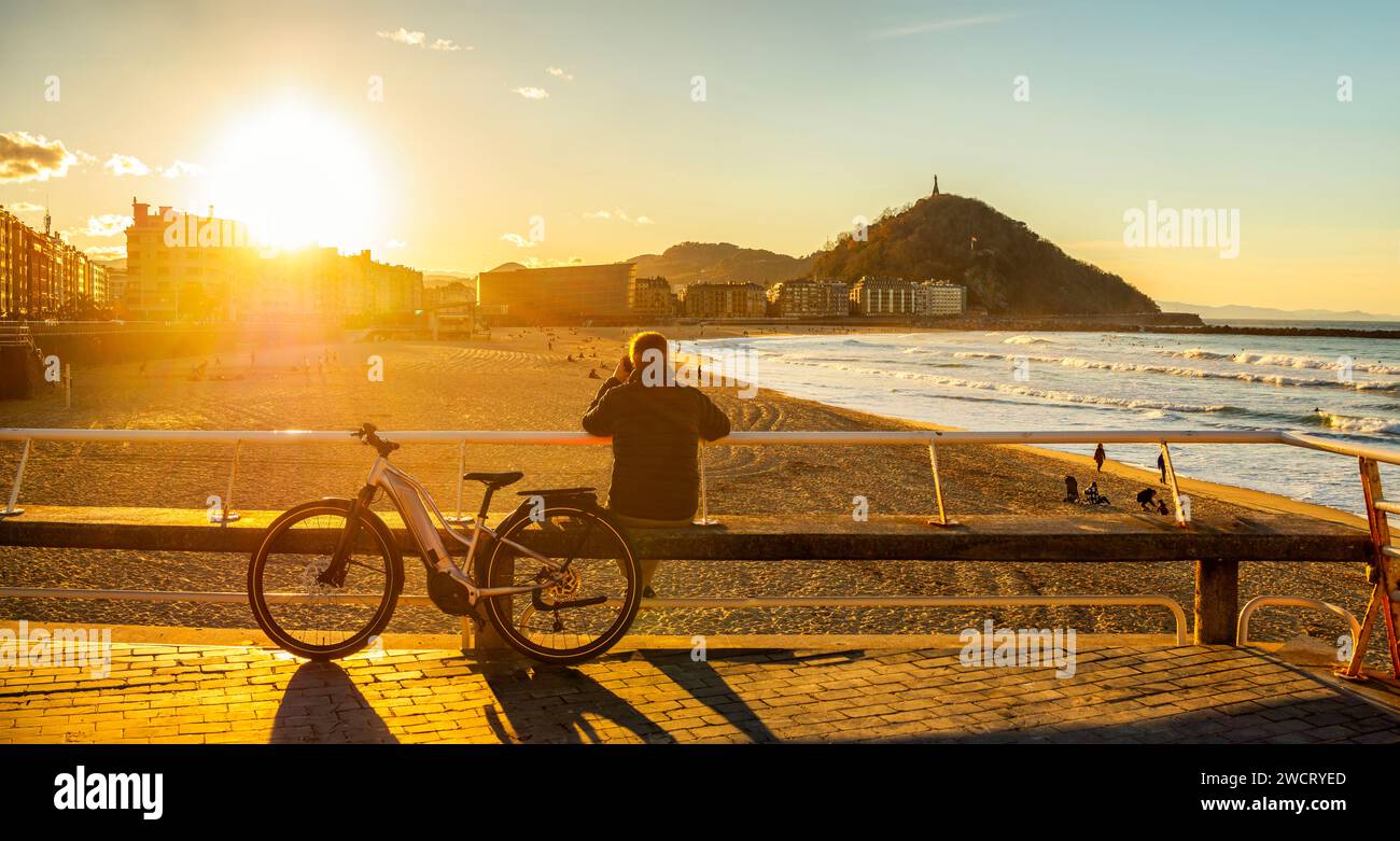 Zurriola Beach at sunset with Monte Urgull in the background. San Sebastian, Basque Country, Guipuzcoa. Spain. Stock Photo