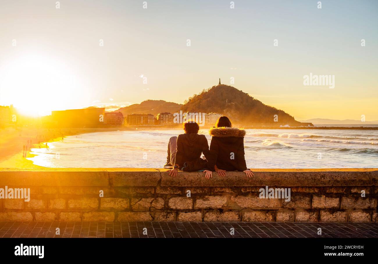 Zurriola Beach at sunset with Monte Urgull in the background. San Sebastian, Basque Country, Guipuzcoa. Spain. Stock Photo