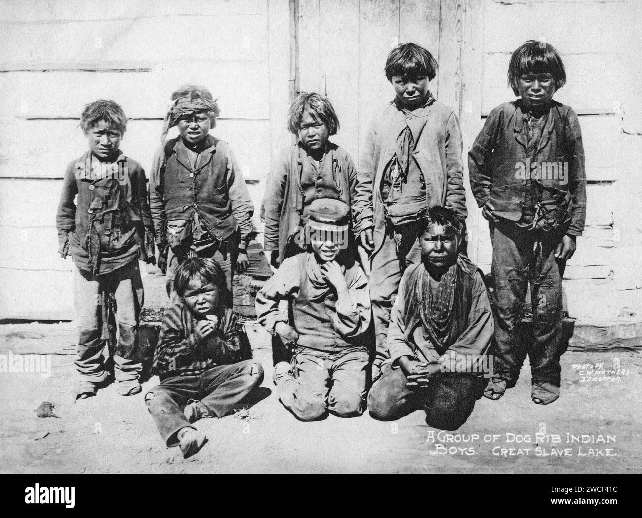 A 1901 photograph of young boys of the Tlicho people, indigenous Dene First Nations people, at Great Slave Lake in the Northwest Territories, taken by C W Mathers on an expedition to the far north of Canada and published in his book ‘The Far North’. Mathers captioned this photograph: A group of Dogrib Indian [Tlicho people] boys, Great Slave Lake. Stock Photo