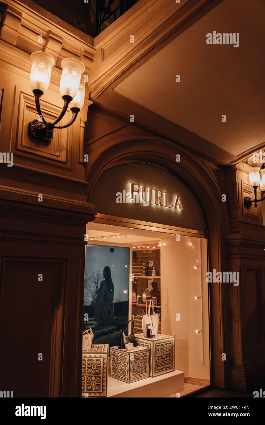 Luxury famous brand Furla retail shop golden logo signboard on the