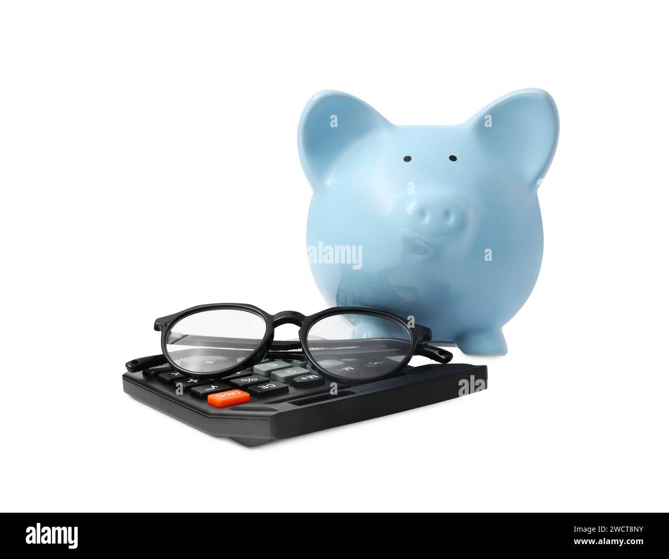 Calculator, glasses and piggy bank isolated on white Stock Photo - Alamy