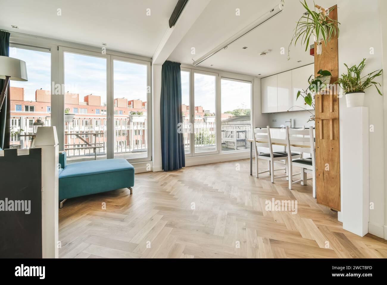 Modern apartment interior with herringbone parquet floor and a ...