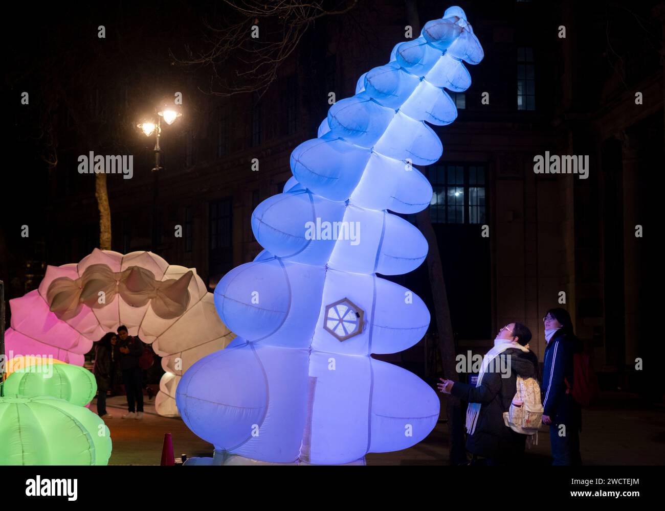 Giant inflatable robots have been unveiled along The Strand in London by Air Giants with King’s College London - The Glowbot Garden is an installation Stock Photo