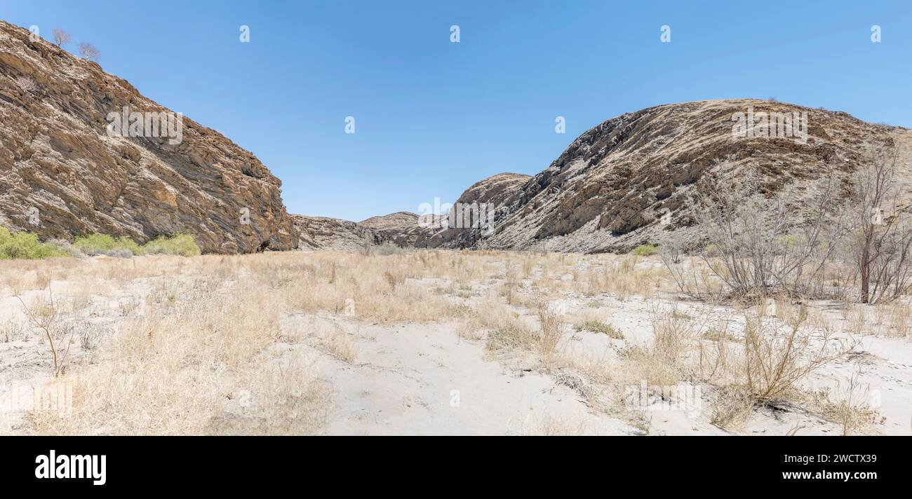 landscape with dry river bed in Naukluft desert, shot in bright late spring light near Kuiseb pass, Namibia, Africa Stock Photo