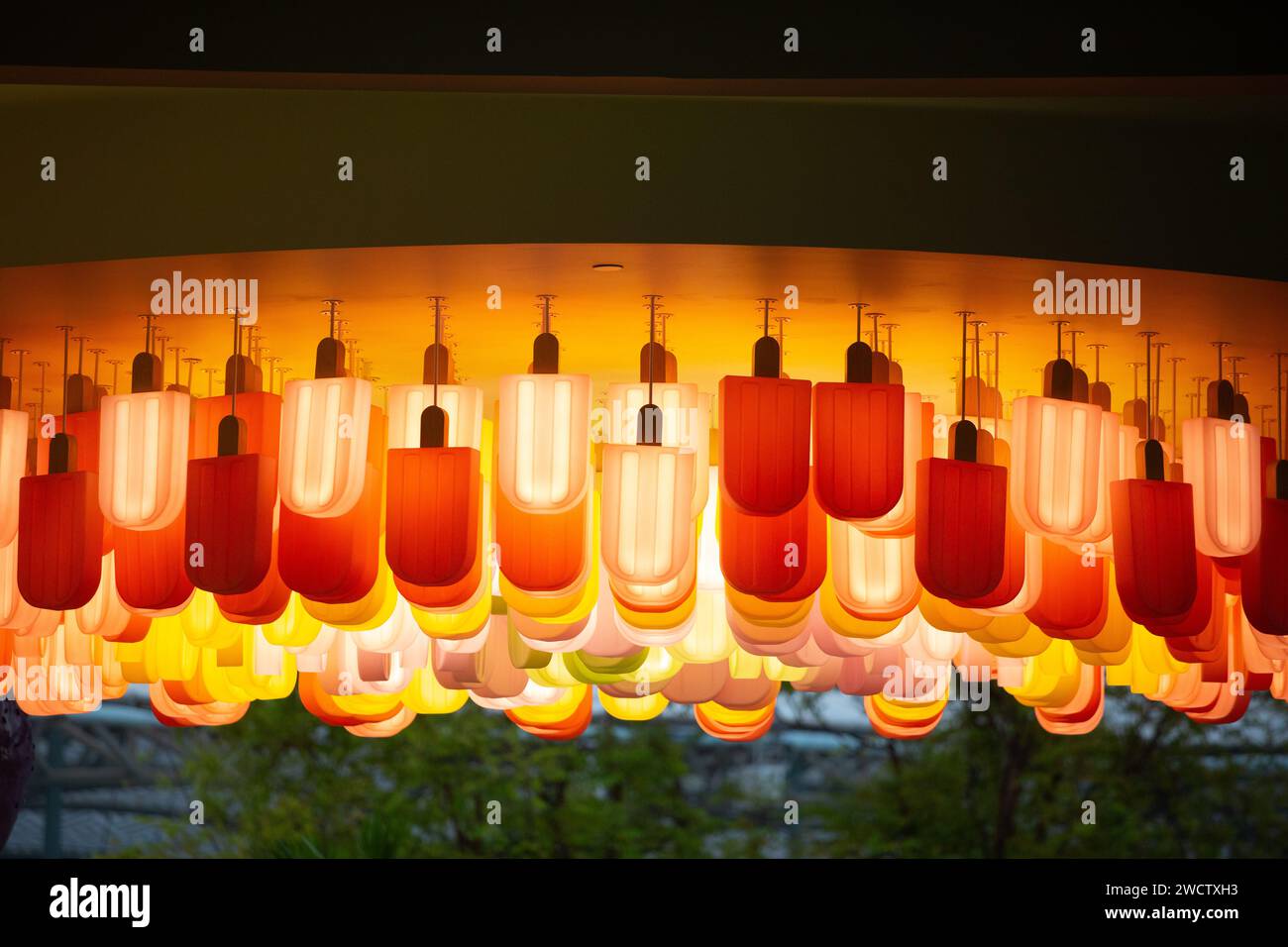 Popsicle hang upside down but is a lighting fixture display decoration to draw the customers for business. Resort World Sentosa, Singapore. Stock Photo