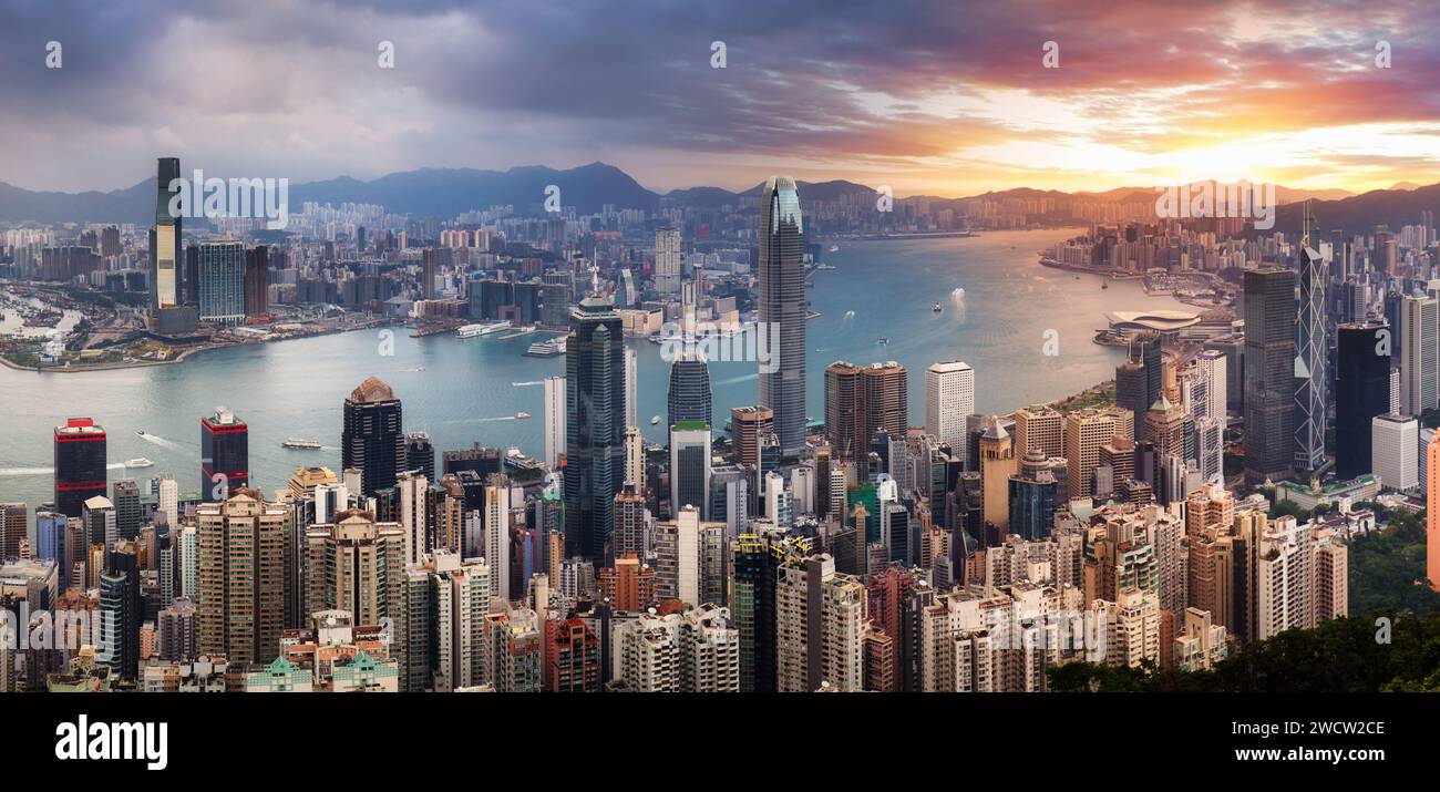 Hong Kong skyline at dramatic sunrise, Victoria harbour Stock Photo - Alamy