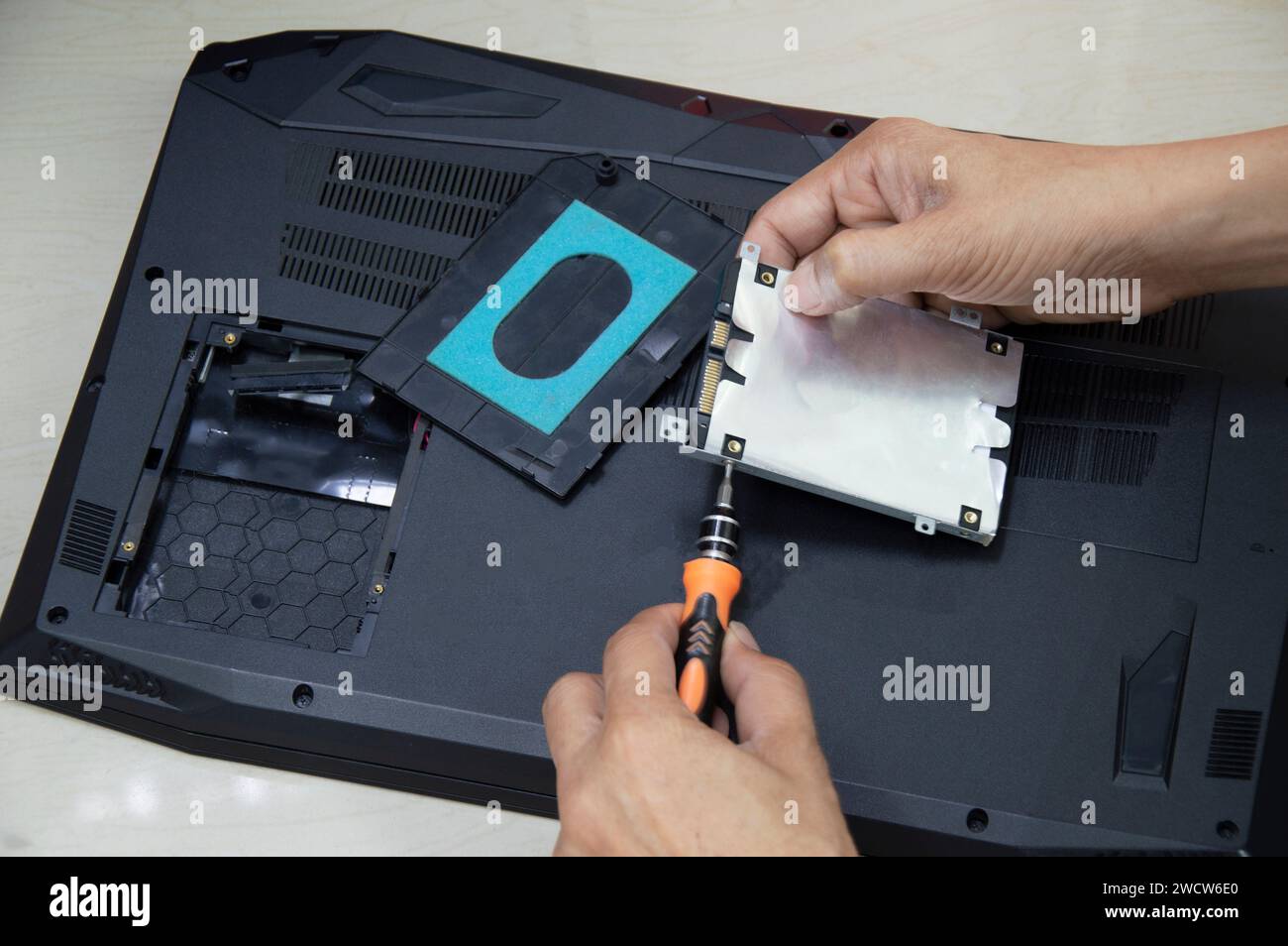 Top view, technician wearing Hard disk, computer repair Stock Photo