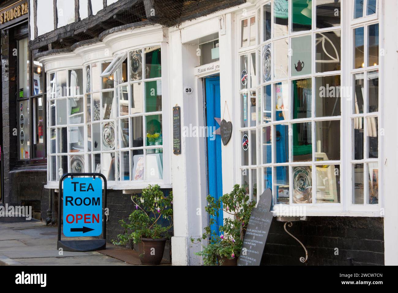 Lincoln, Lincolnshire, England. Colourful sign welcoming customers to Bells, a traditional tea room and coffee house on Steep Hill. Stock Photo